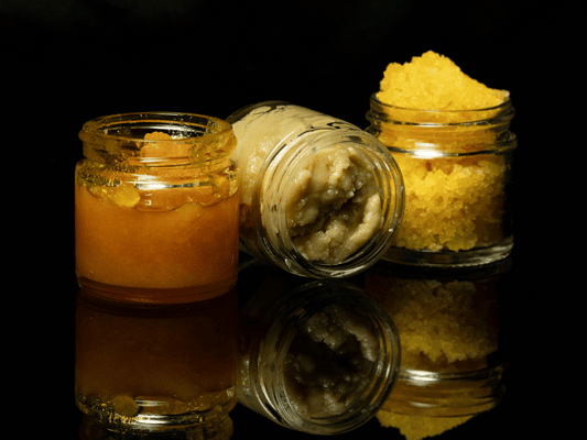 Three jars of THCA concentrates featuring different textures, including live resin and live rosin extracts.